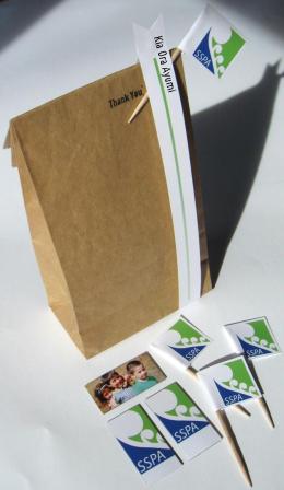 Recycled mini flags and promotional magnets made from old brochure stock to save on printing anew.